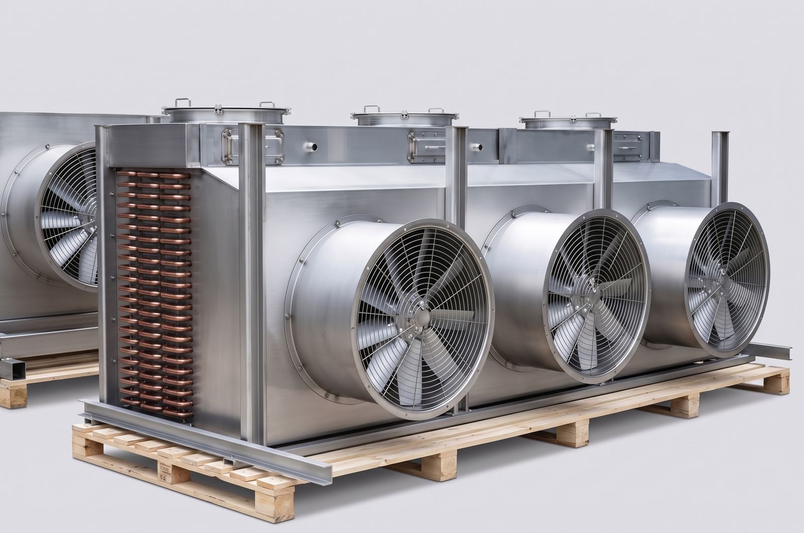 Stainless steel unit cooler with three stainless axial fans in draw through cowls and clamped stainless drain pan covers.