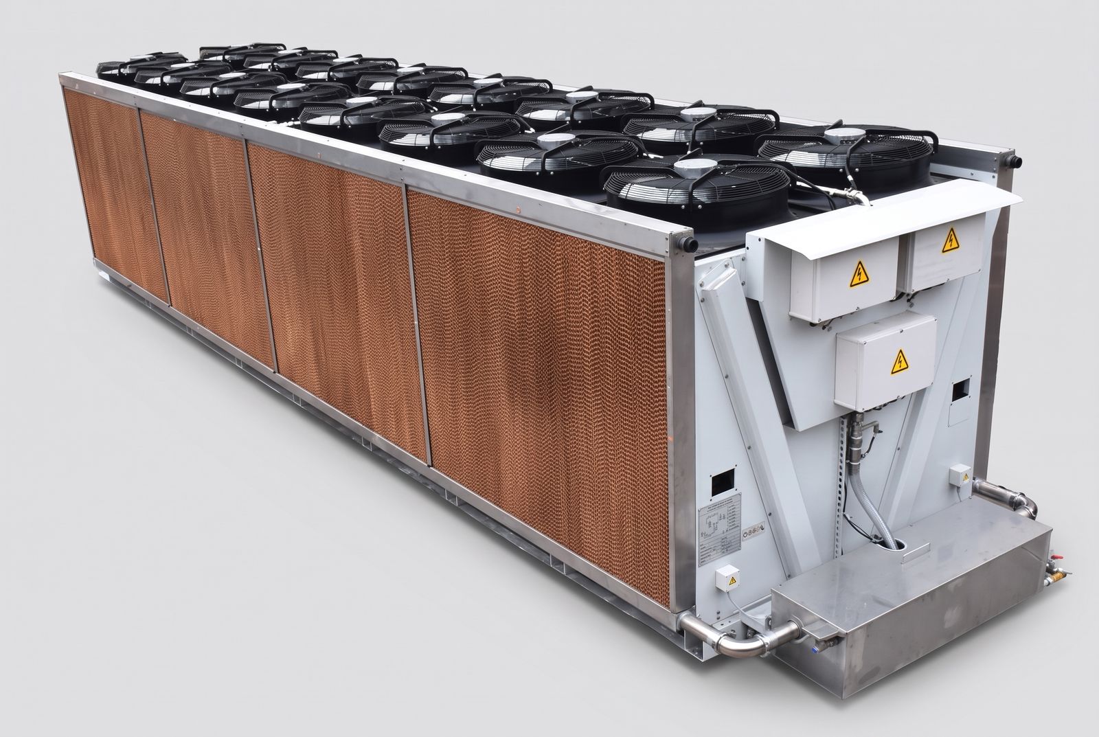 Large adiabatic oil cooler with eighteen axial fans, cellulose pre-cooling pads along the side and a stainless water manifold.