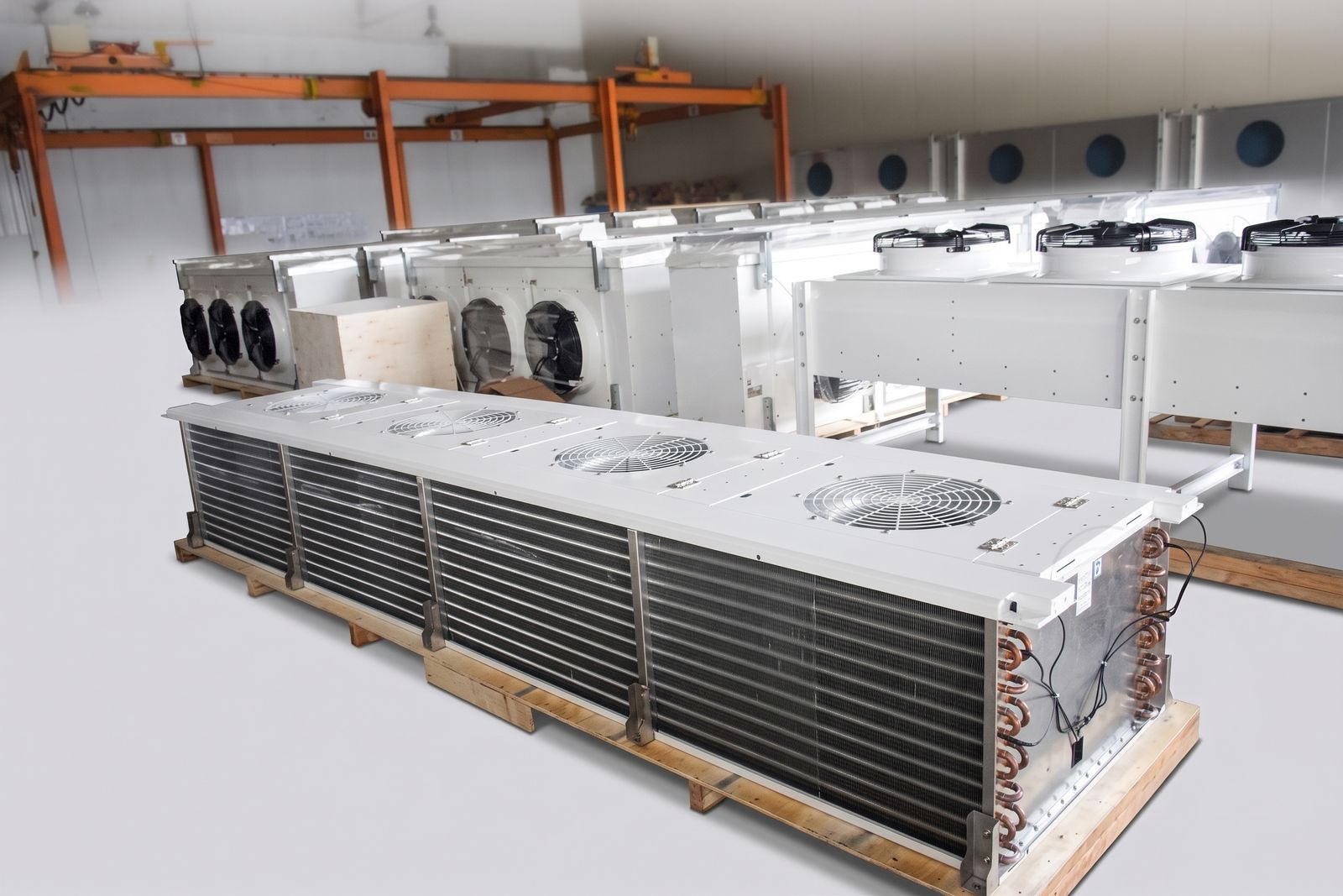 Low profile unit cooler with four fans set into the top panel and a tall aluminum fin block.